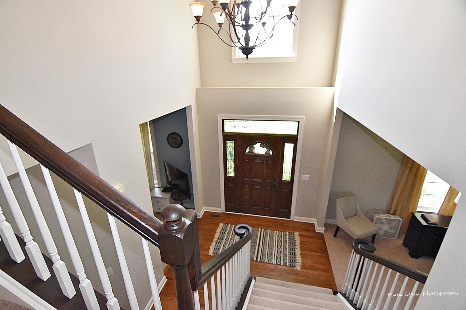 37W200 Red Gate Road St. Charles, IL 60175 - Photo 19 of 47 a view of a hallway with wooden floor and staircase