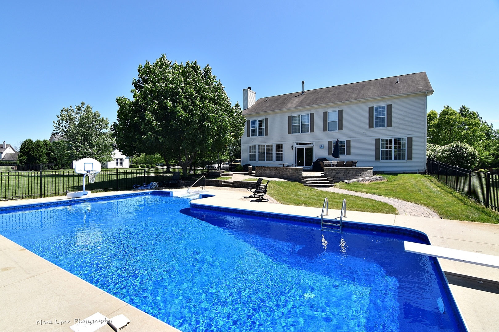 37W200 Red Gate Road St. Charles, IL 60175 - Photo 35 of 47 a view of a swimming pool with a lounge chairs
