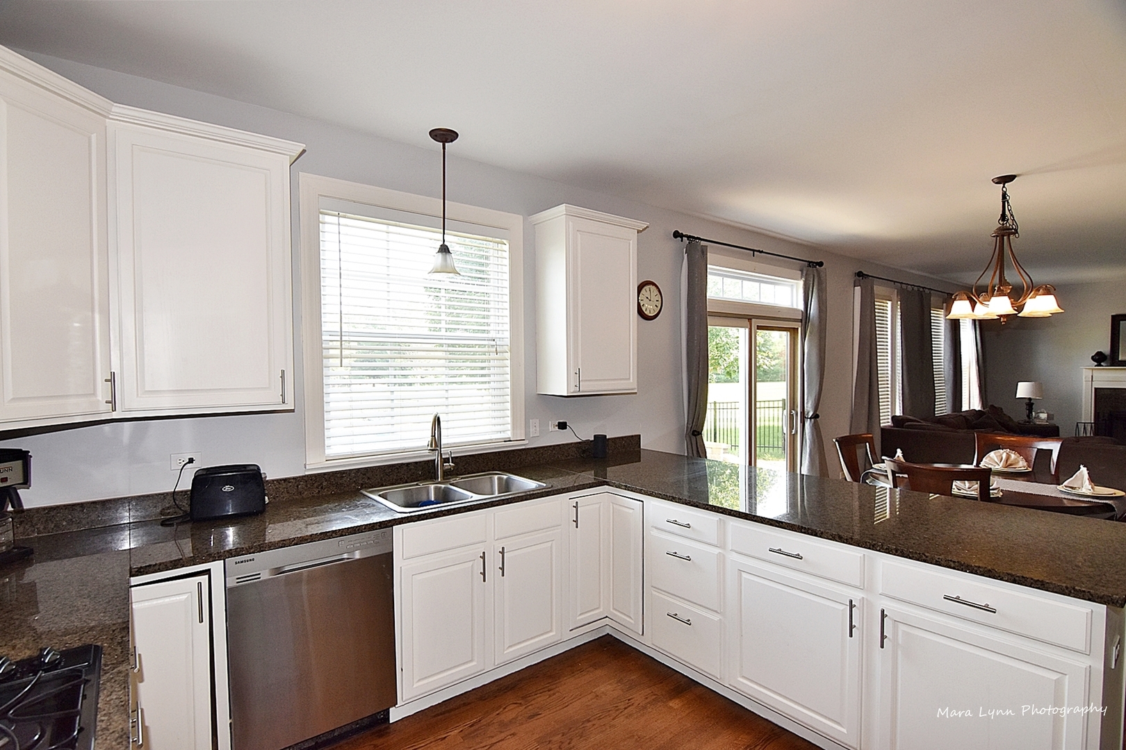 37W200 Red Gate Road St. Charles, IL 60175 - Photo 5 of 47 a kitchen with granite countertop a sink white cabinets and white appliances