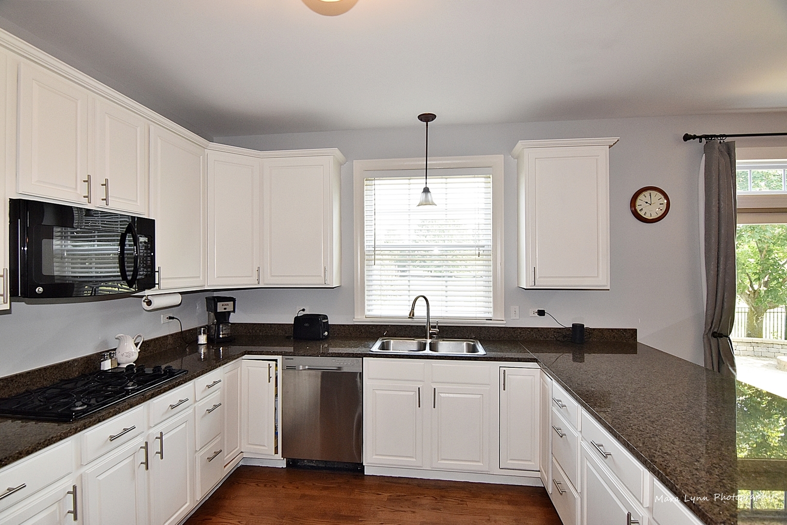 37W200 Red Gate Road St. Charles, IL 60175 - Photo 7 of 47 a kitchen with granite countertop white cabinets sink and window
