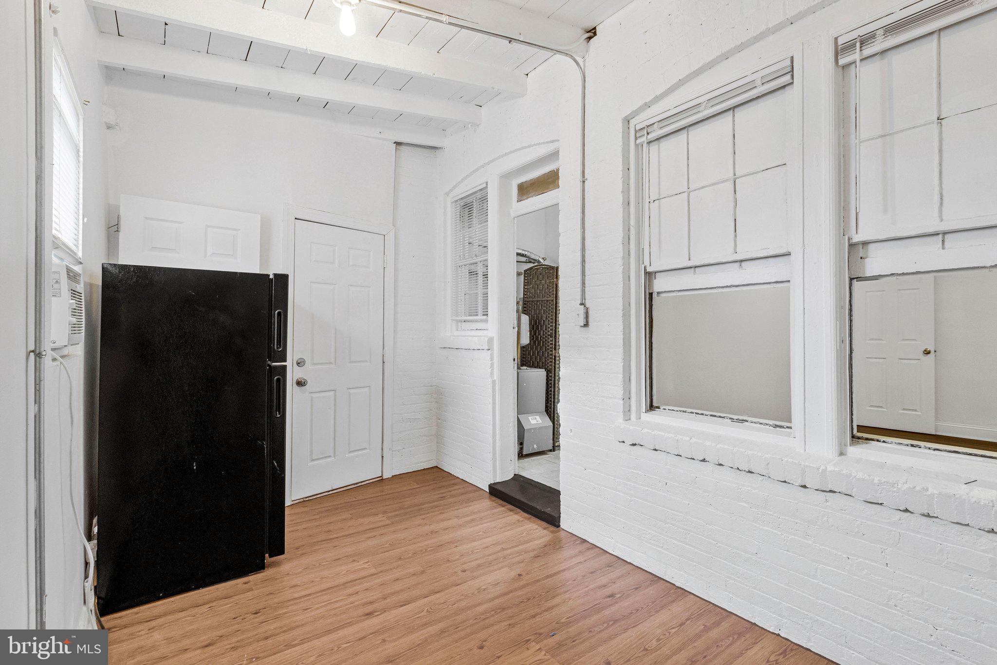 1111 Queen Street Northeast, Unit 3 Washington, DC 20002 - Photo 7 of 8 a view of empty room with wooden floor