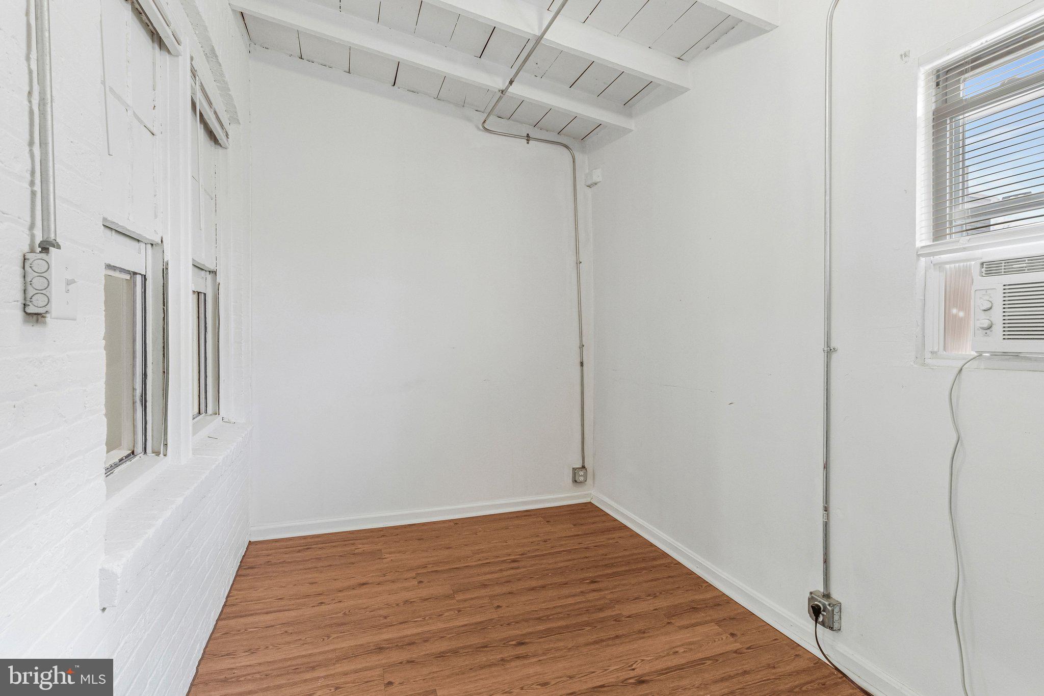 1111 Queen Street Northeast, Unit 3 Washington, DC 20002 - Photo 8 of 8 a view of a room with wooden floor and staircase