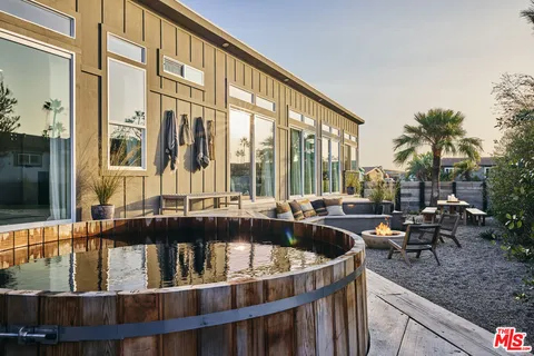 a view of swimming pool with outdoor seating