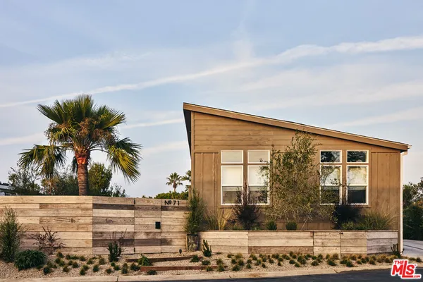 a front view of a house with a ocean view