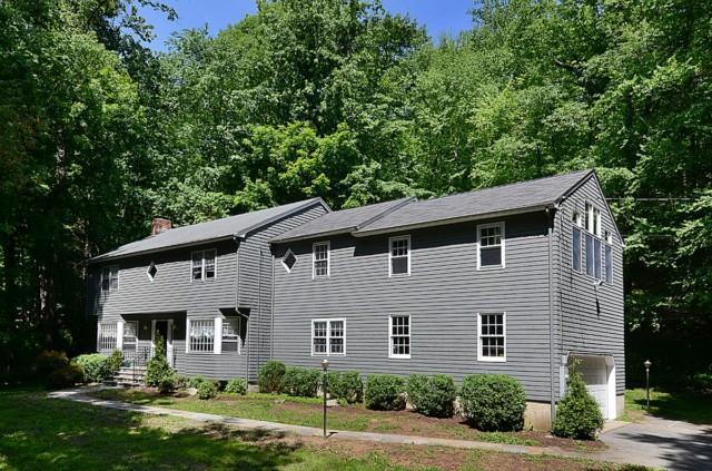 91 Minute Man Road Ridgefield, CT 06877 - Photo 1 of 1 a front view of a house with a yard