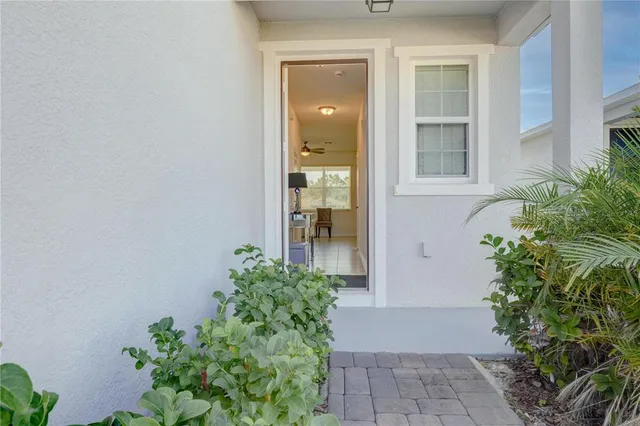 front view of a house with a potted plant