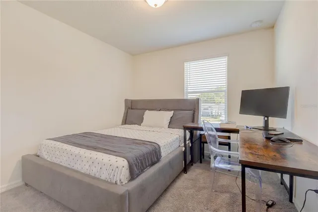 a white toilet sitting next to a shower