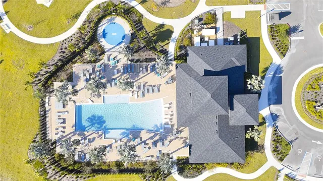 a view of a swimming pool with outdoor seating