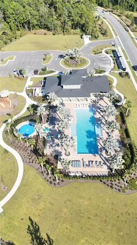 aerial view of a house with a yard