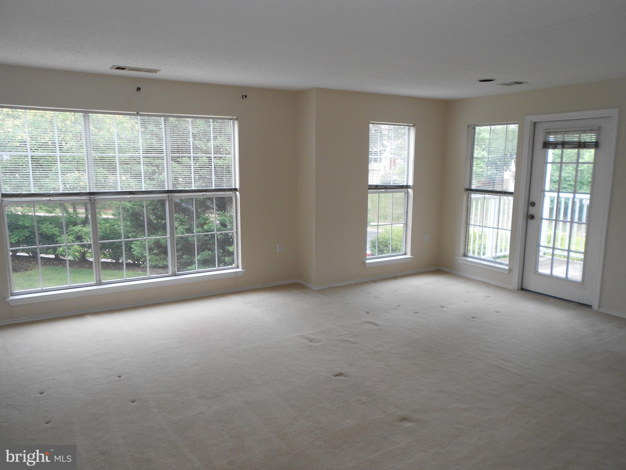 20950 Timber Ridge Terrace, Unit 203 Ashburn, VA 20147 - Photo 20 of 30 a view of an empty room with a window