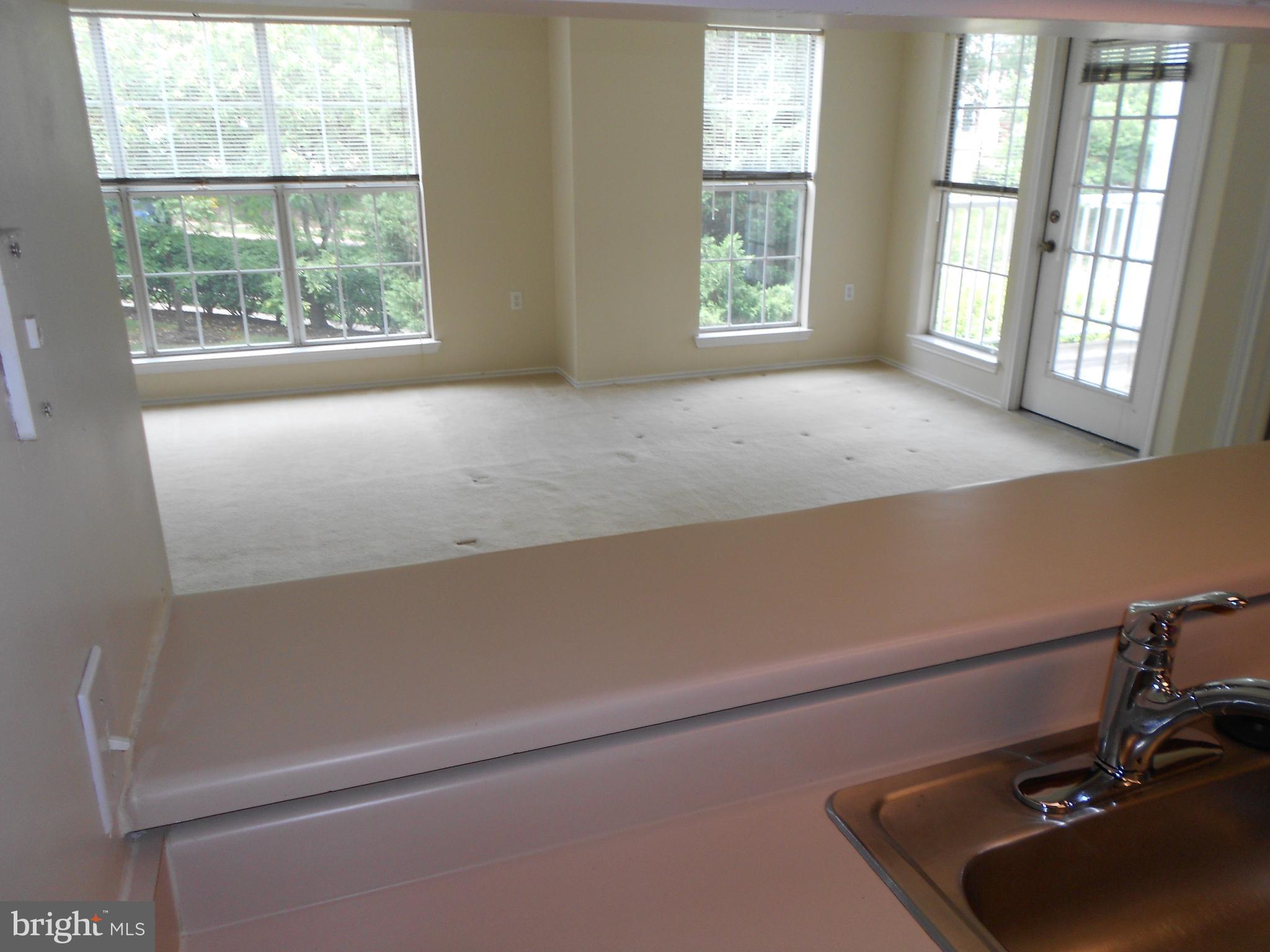 20950 Timber Ridge Terrace, Unit 203 Ashburn, VA 20147 - Photo 9 of 30 a room with a window