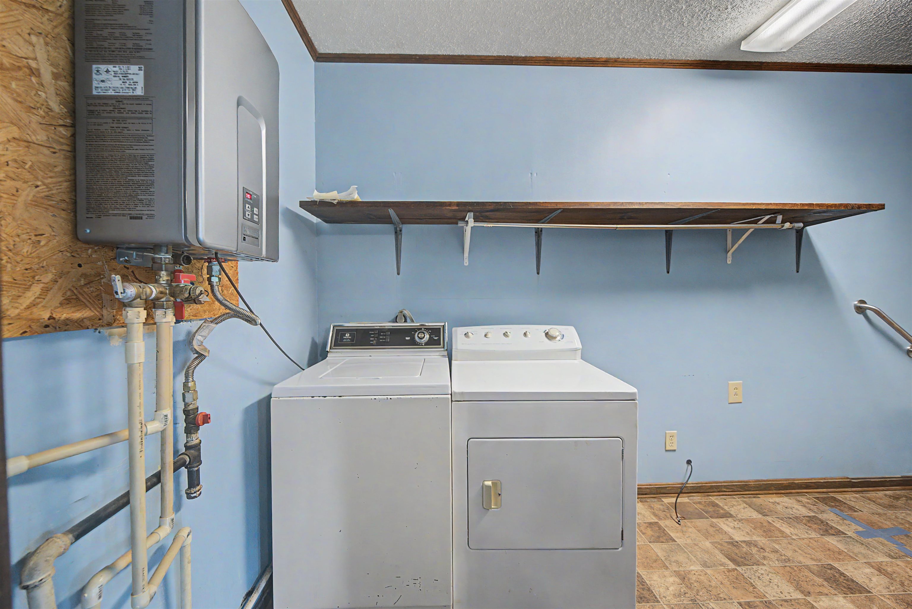 12 Baker Road Selmer, TN 38375 - Photo 20 of 28 a utility room with dryer and washer