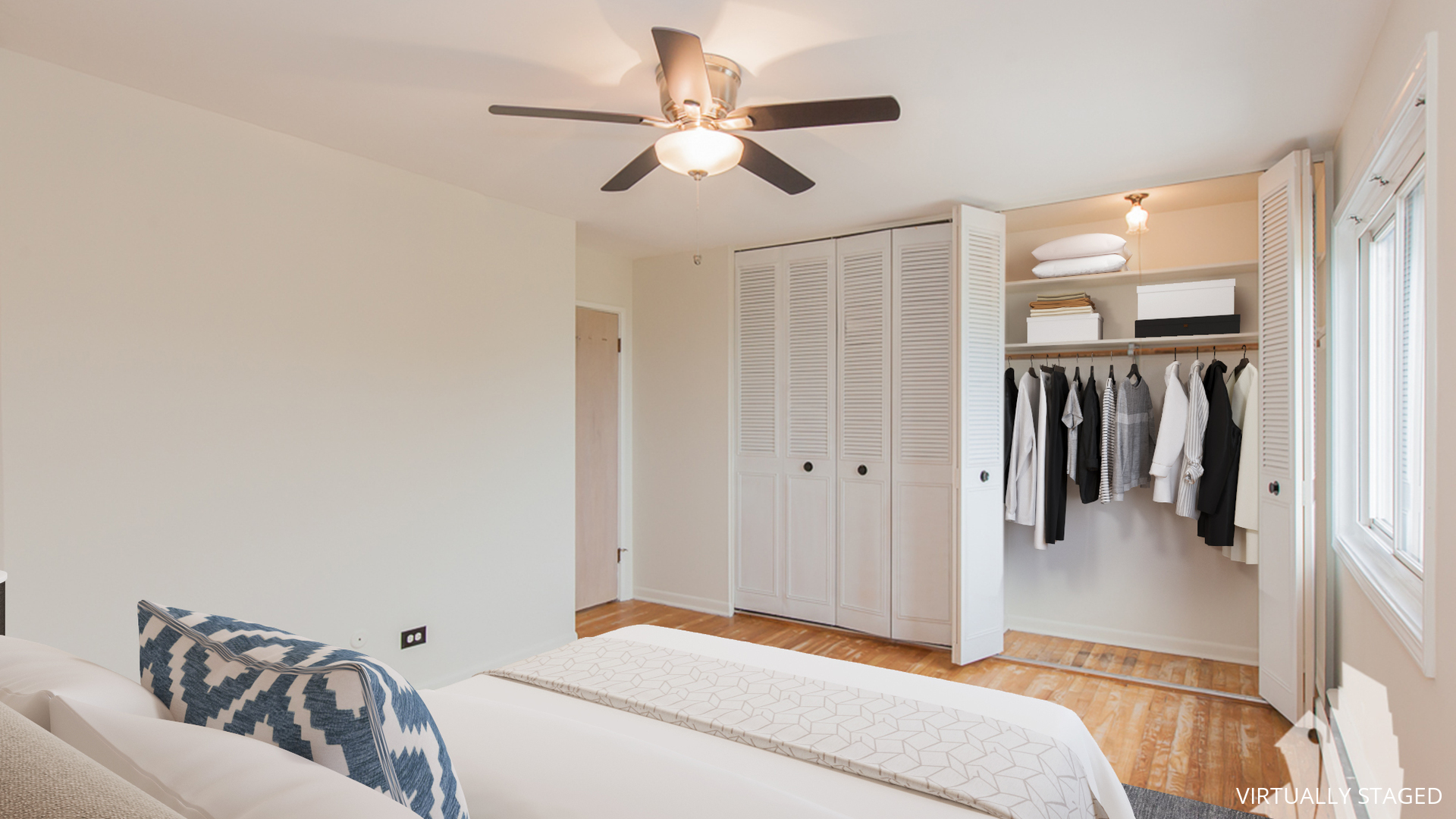 7120 North Sheridan Road, Unit 401 Chicago, IL 60626 - Photo 8 of 9 a bedroom with a bed and a couch