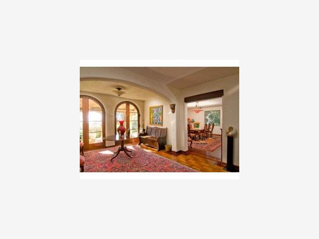 1553 Riata Road Pebble Beach, CA 93953 - Photo 3 of 9 a living room with a table and chairs