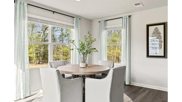 a view of a room with a window and dining area