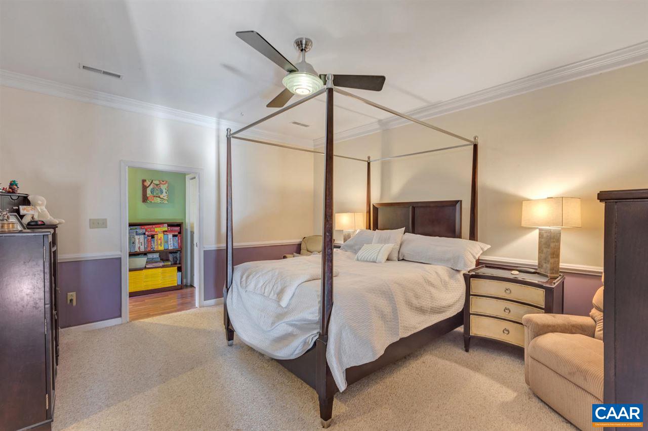 25 Riverside Drive Palmyra, VA 22963 - Photo 13 of 49 a bedroom with a bed and ceiling fan