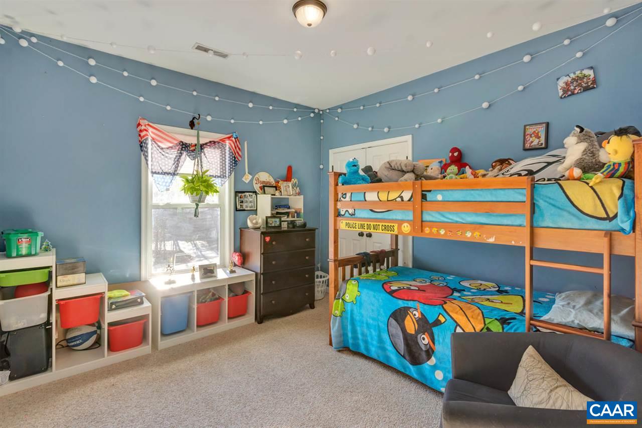 25 Riverside Drive Palmyra, VA 22963 - Photo 20 of 49 a bedroom with a bed and a window