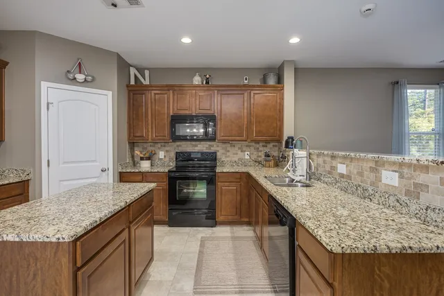 a bathroom with a sink a toilet and shower curtain