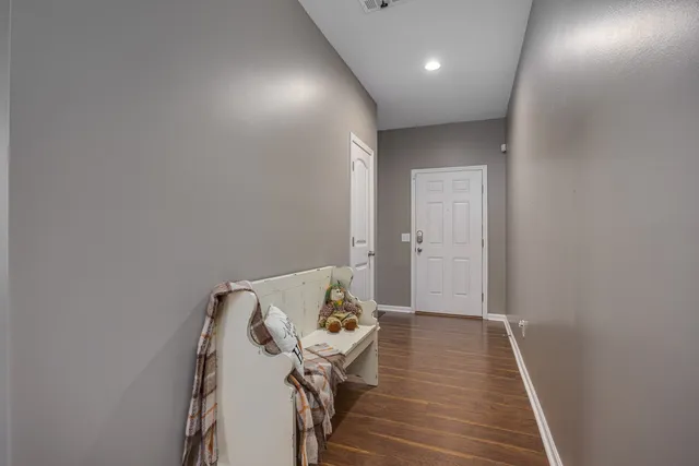 a view of a patio with chair and table and chairs and potted plants