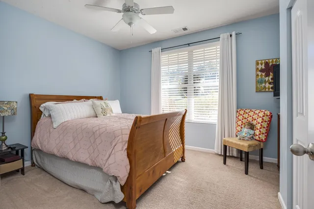 a view of a backyard with sitting area and garden