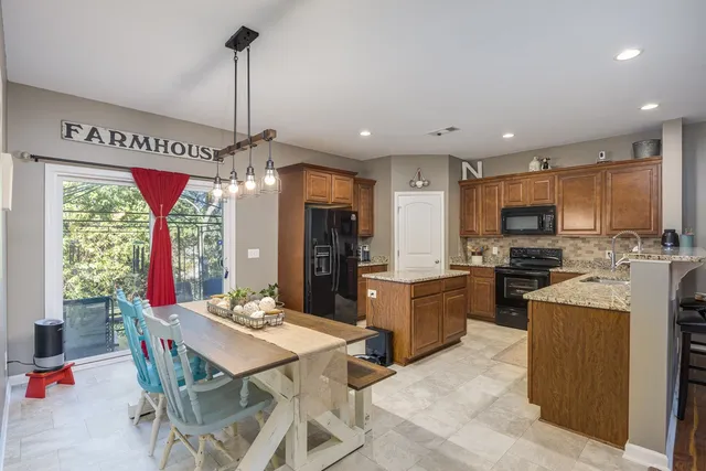 a living room with furniture a window and a chandelier