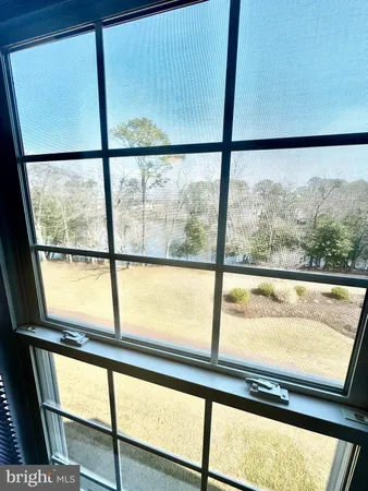 a view of an empty room with a large window