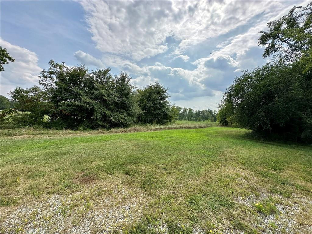 5545 Woodsdale Road Roxboro, NC 27574 - Photo 24 of 24 a view of a green field with wooden fence