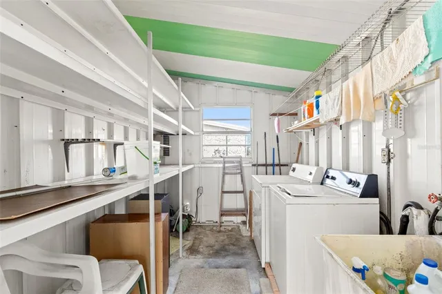 a view of living room with furniture and windows