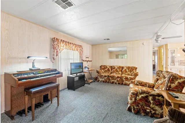 a bed room with furniture and a window