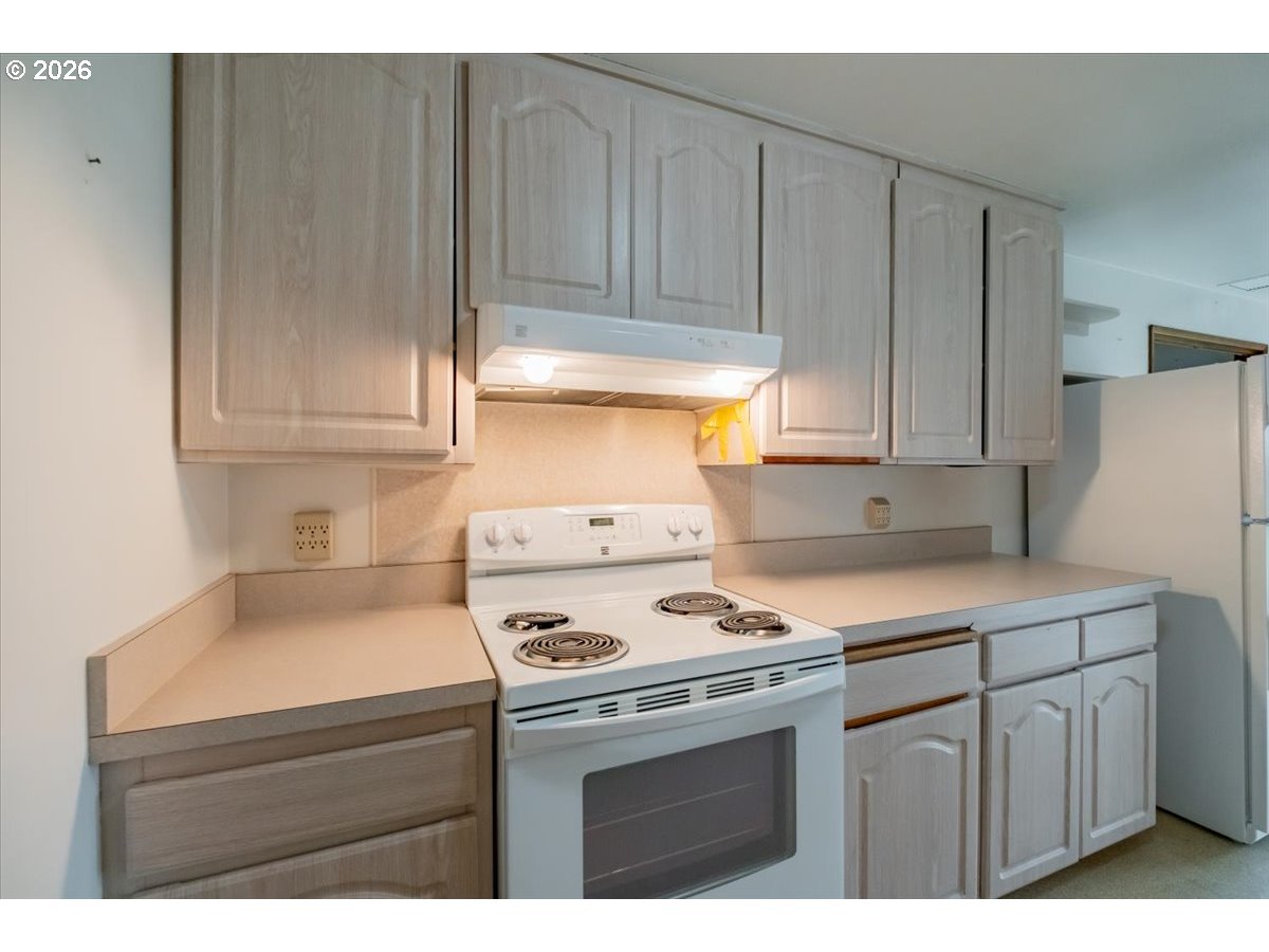 341 Northeast Cambridge Circle Corvallis, OR 97330 - Photo 11 of 46 a kitchen with appliances cabinets and a counter top space