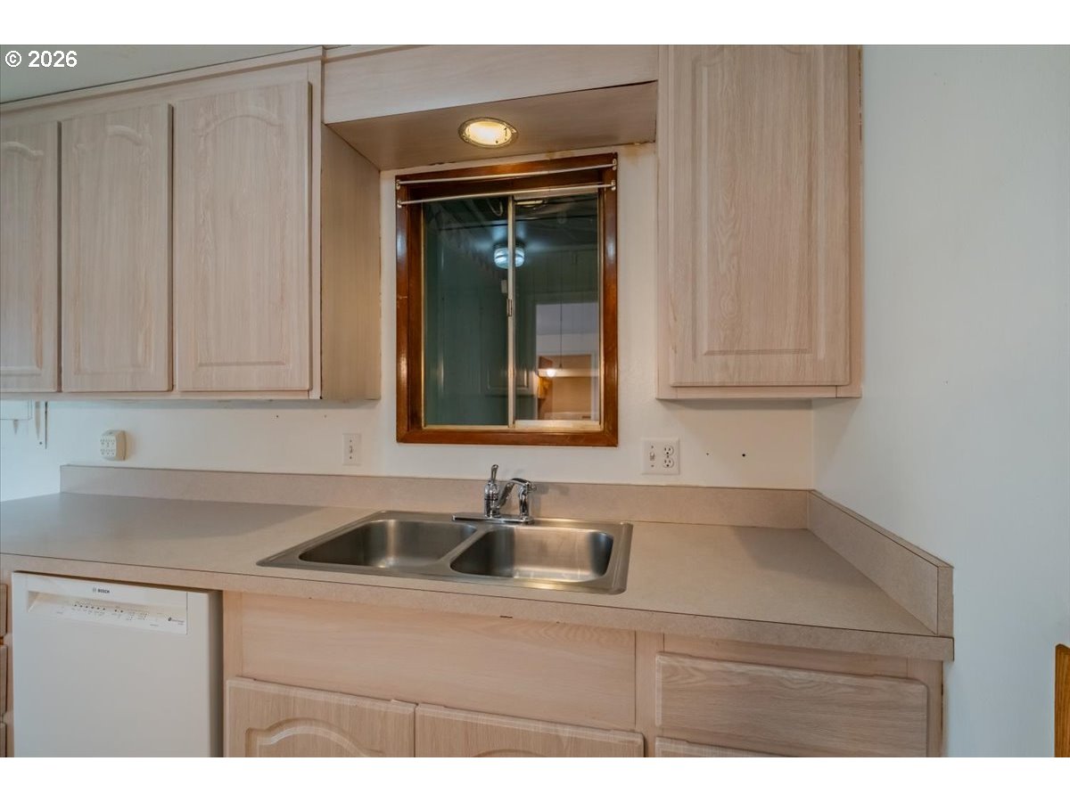 341 Northeast Cambridge Circle Corvallis, OR 97330 - Photo 12 of 46 a kitchen with a sink and cabinets