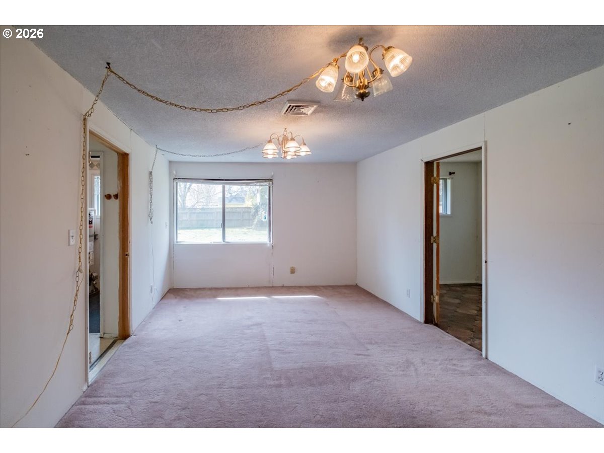 341 Northeast Cambridge Circle Corvallis, OR 97330 - Photo 18 of 46 a view of an empty room with a window