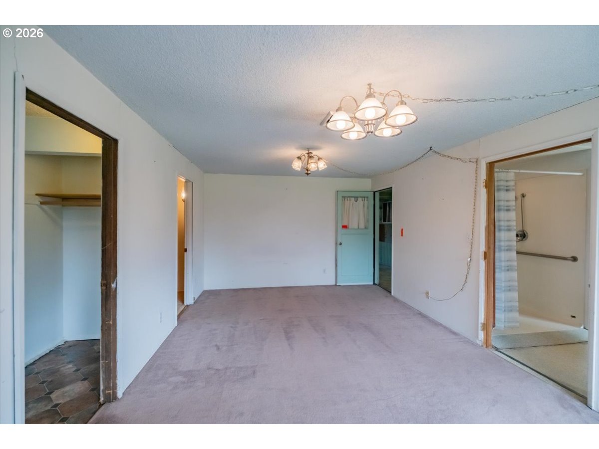 341 Northeast Cambridge Circle Corvallis, OR 97330 - Photo 19 of 46 a view of an empty room with a chandelier fan