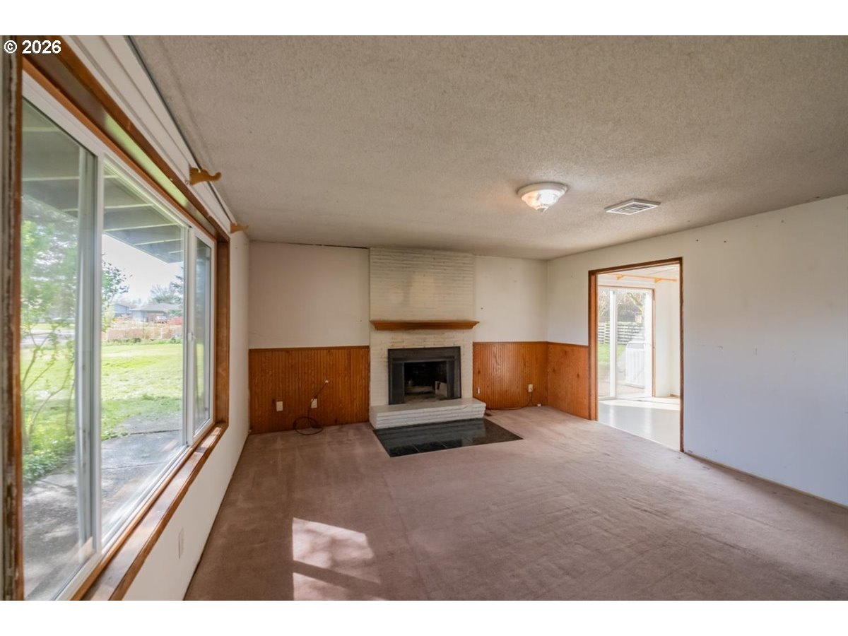 341 Northeast Cambridge Circle Corvallis, OR 97330 - Photo 4 of 46 a living room with furniture and a fireplace