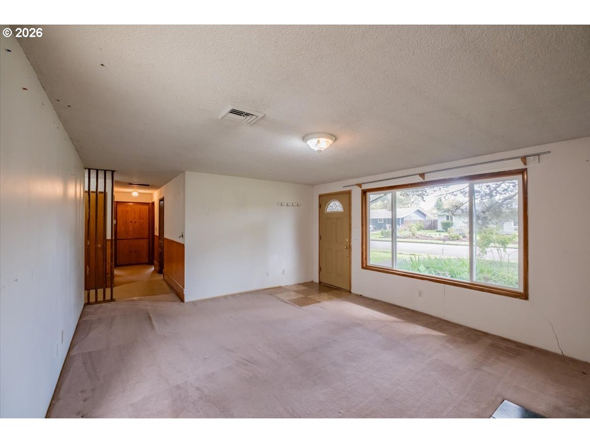 341 Northeast Cambridge Circle Corvallis, OR 97330 - Photo 6 of 46 a view of an empty room with a window