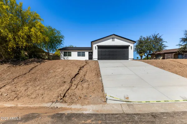 a front view of a house with a yard