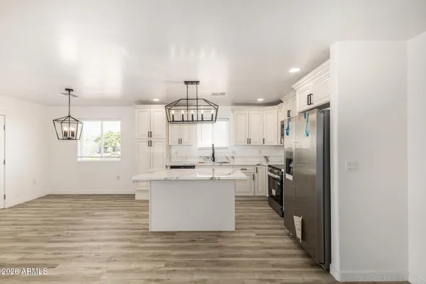 a view of a kitchen from the hallway