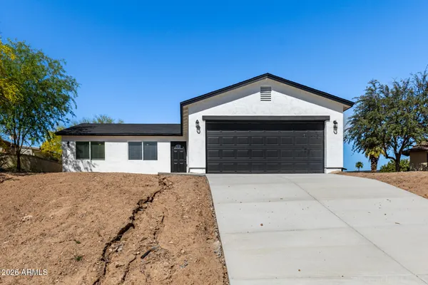 a front view of a house with yard