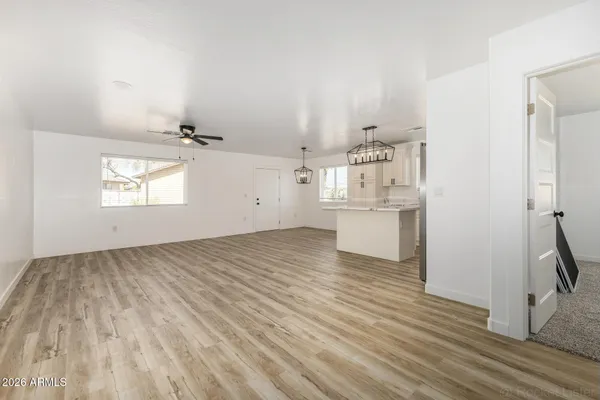 wooden floor in an empty room and a window
