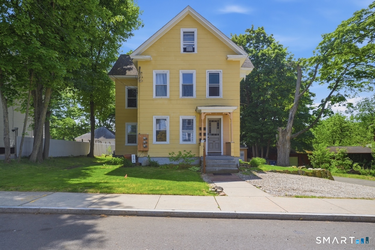 12 Webster Street Vernon, CT 06066 - Photo 2 of 33 a view of a white house with a yard and large trees