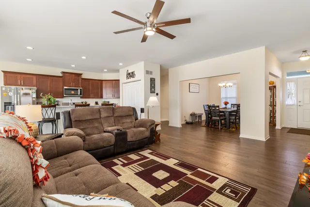 a living room with furniture and kitchen view