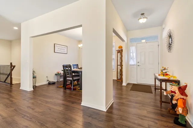 a view of a room with furniture and wooden floor