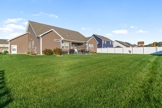 a view of a yard in front of a house with a yard