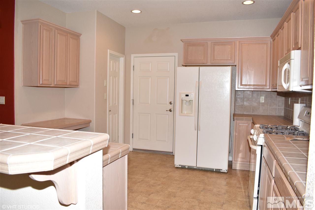 1895 Stetson Drive Reno, NV 89521 - Photo 8 of 24 a view of kitchen with furniture and wooden floor