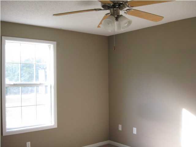 6216 Winstead Road Crestview, FL 32539 - Photo 9 of 10 an empty room with a window