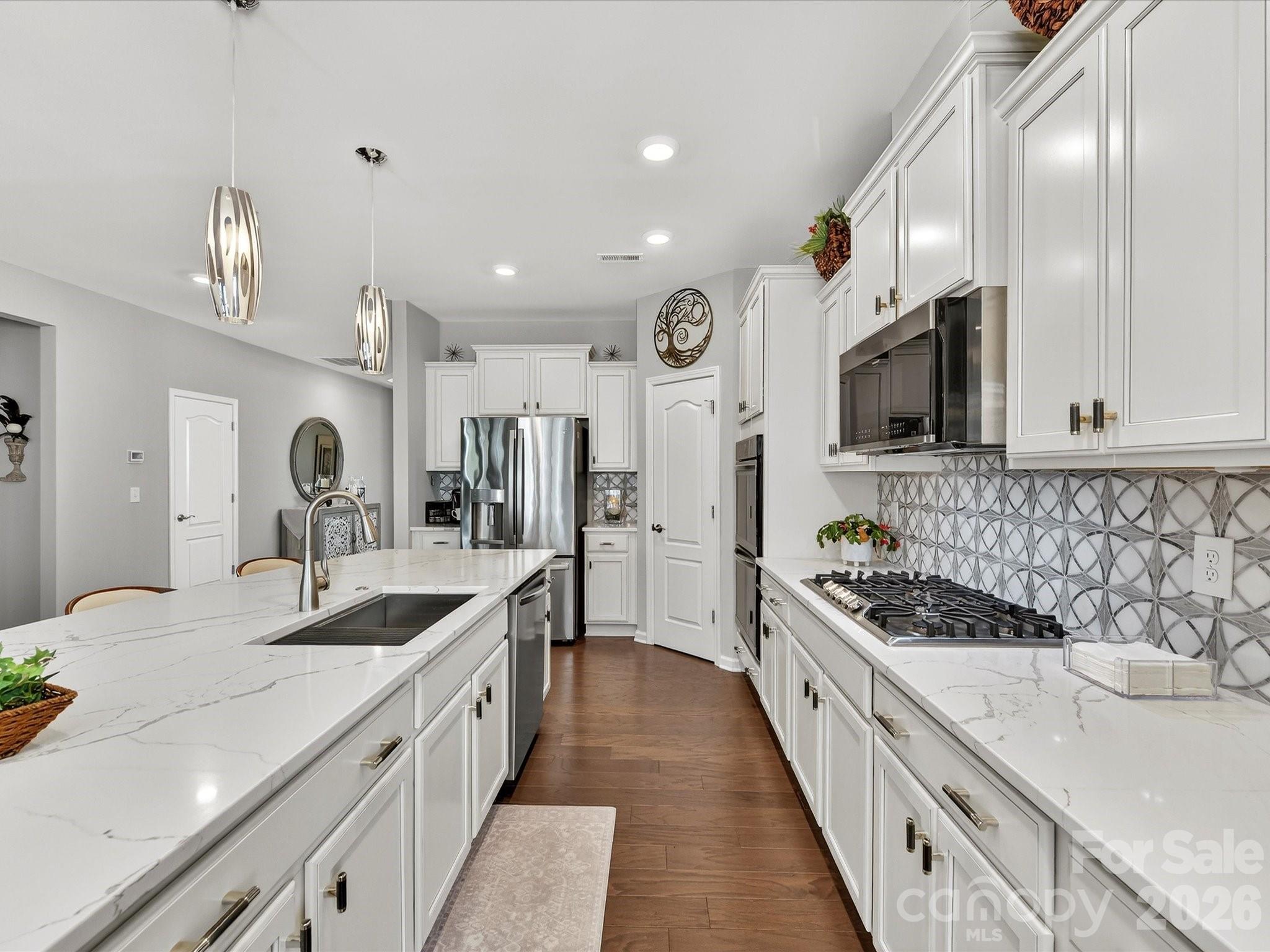 3355 Oliver Stanley Trail Lancaster, SC 29720 - Photo 15 of 48 a large kitchen with a sink and cabinets