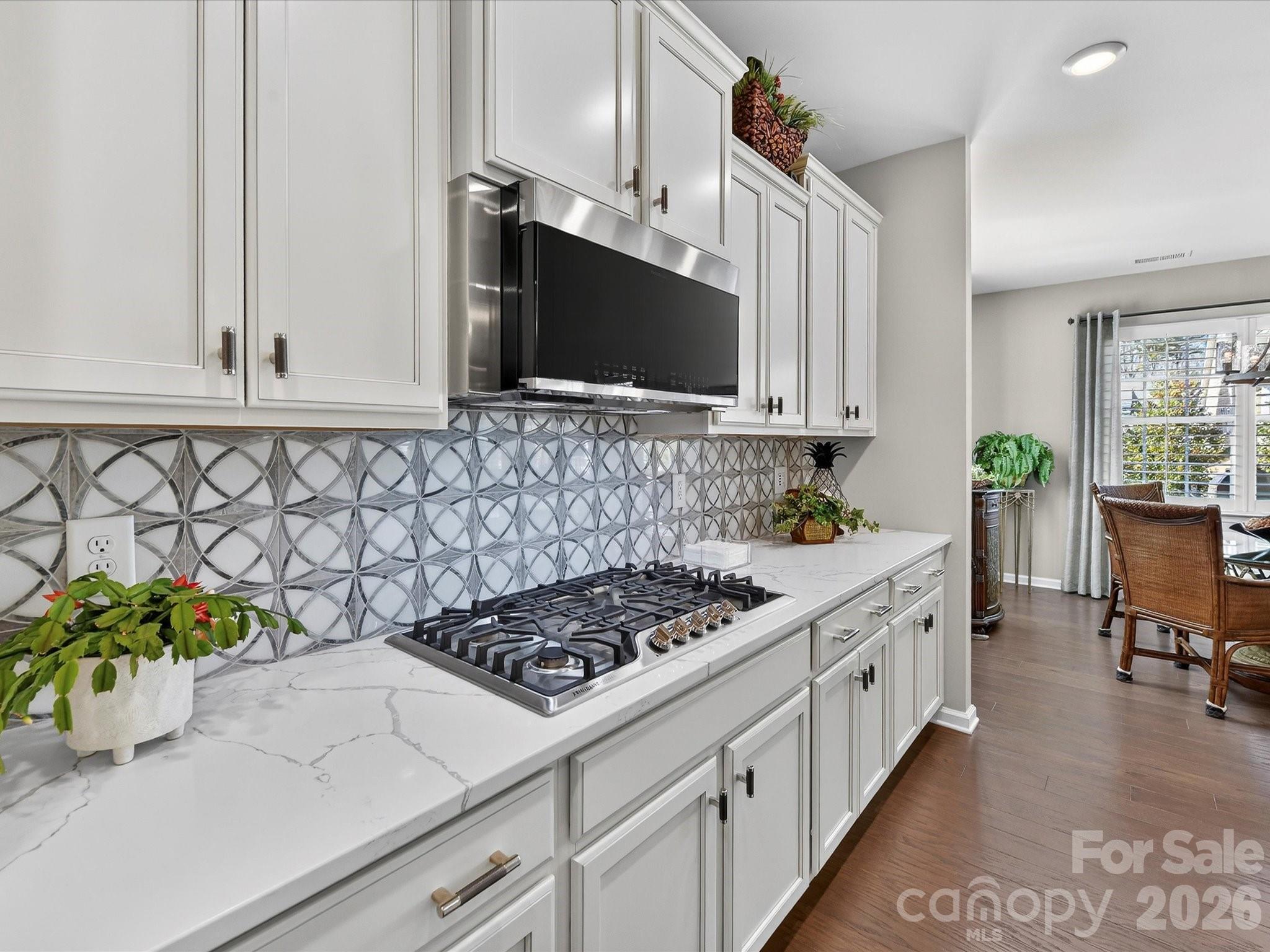 3355 Oliver Stanley Trail Lancaster, SC 29720 - Photo 16 of 48 a kitchen with stainless steel appliances white cabinets and a stove