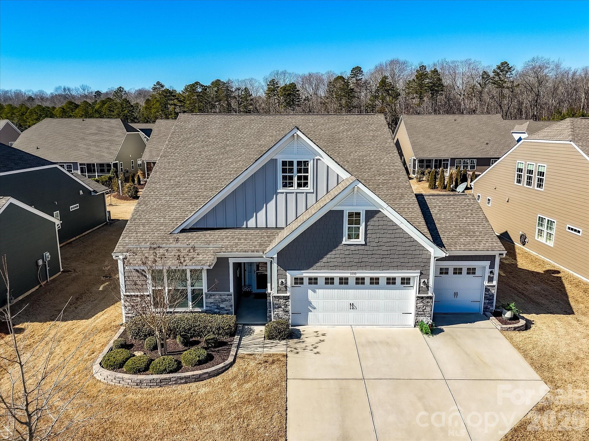 3355 Oliver Stanley Trail Lancaster, SC 29720 - Photo 2 of 48 a house with tall trees in the background