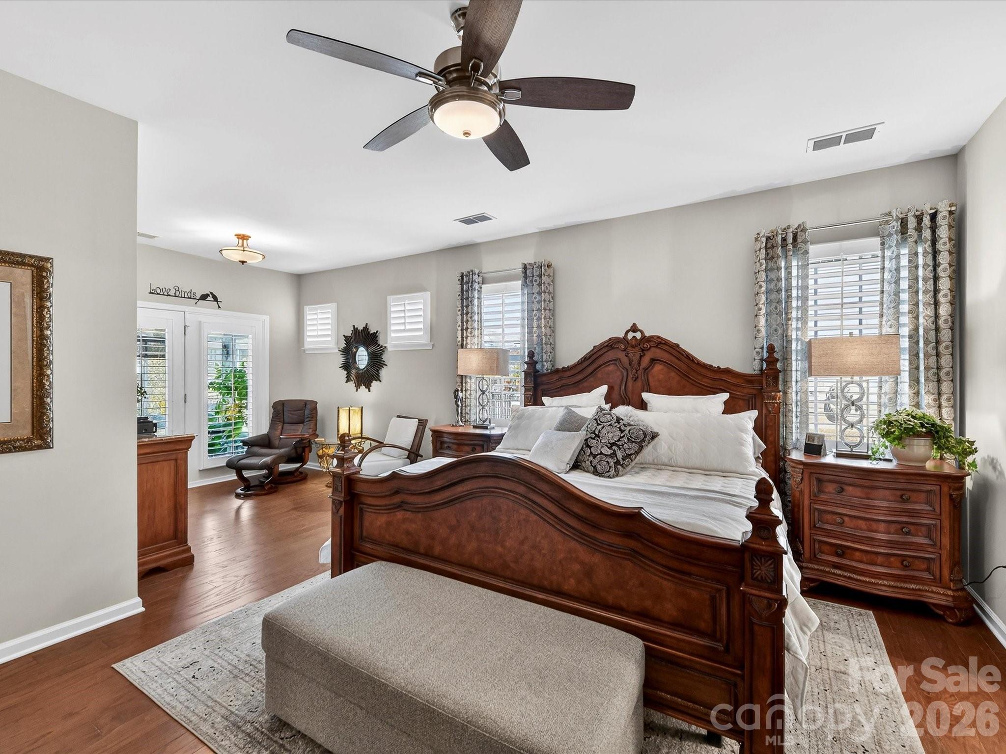 3355 Oliver Stanley Trail Lancaster, SC 29720 - Photo 22 of 48 a spacious bedroom with a bed a couch and a window