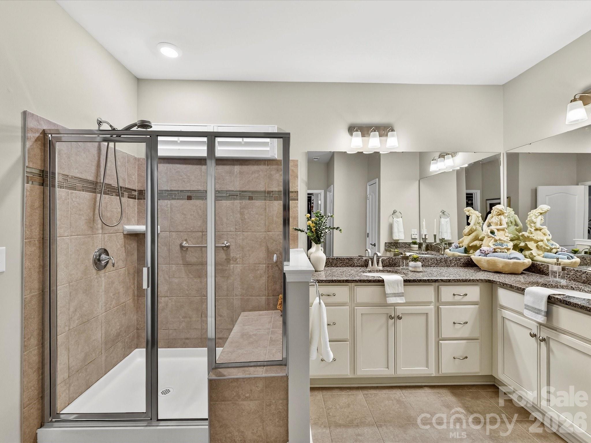3355 Oliver Stanley Trail Lancaster, SC 29720 - Photo 25 of 48 a bathroom with a double vanity sink mirror and shower